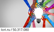 Diverse society thinking together and team ideas as group of people coming together joining hands into the shape of an inspirational light bulb as a community diversity metaphor with 3D elements. Стоковое фото, агентство Ingram Publishing / Фотобанк Лори