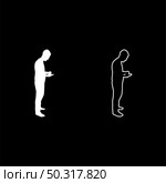 Man holding smartphone phone Playing tablet Male using communication tool Idea looking phone addiction Concept dependency from modern technologies silhouette white color vector illustration solid outline style simple image. Man holding smartphone phone Playing tablet Male using communication tool Idea looking phone addiction Concept dependency from modern technologies silhouette white color vector illustration solid outline style image. Стоковая иллюстрация, агентство Ingram Publishing / Фотобанк Лори