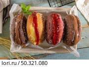 Bolas de Berlim, or "Berlin Balls". Portuguese fried dough with sugar, Filled with sweet cream. Стоковое фото, агентство Ingram Publishing / Фотобанк Лори