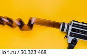 celluloid with vintage videocamera. Стоковое фото, агентство Ingram Publishing / Фотобанк Лори
