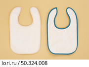 cute baby bibs arrangement. Стоковое фото, агентство Ingram Publishing / Фотобанк Лори