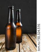 front view beer glass bottles. Стоковое фото, агентство Ingram Publishing / Фотобанк Лори