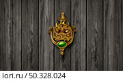 Haunted door with a spooky entrance knocker from a haunted old mansion as a symbol of a scary old vintage doorway with a metal demon ornament as a horror icon for Halloween celebration with 3D illustration elements. . Стоковое фото, агентство Ingram Publishing / Фотобанк Лори