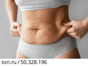 hands holding body fat. High resolution photo. hands holding body fat. Стоковое фото, агентство Ingram Publishing / Фотобанк Лори