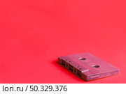 compact cassette red. High resolution photo. compact cassette red. High quality photo. Стоковое фото, агентство Ingram Publishing / Фотобанк Лори