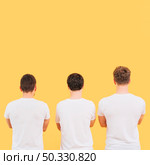 rear view men white t shirt standing against yellow background. High resolution photo. rear view men white t shirt standing against yellow background. High quality photo. Стоковое фото, агентство Ingram Publishing / Фотобанк Лори