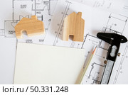 figures house caliper drafts. High resolution photo. figures house caliper drafts. High quality photo. Стоковое фото, агентство Ingram Publishing / Фотобанк Лори