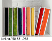 colorful books shelf arrangement. High resolution photo. colorful books shelf arrangement. High quality photo. Стоковое фото, агентство Ingram Publishing / Фотобанк Лори