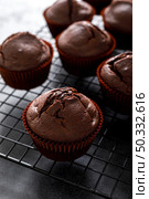 Chocolate muffins on dark background. Стоковое фото, агентство Ingram Publishing / Фотобанк Лори
