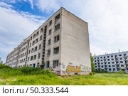 Ghost Town Buildings, Former Secret Soviet Radar Base Village. Irbene, Latvia, 18 June 2025. Редакционное фото, фотограф Zydrius Tartenis / Фотобанк Лори