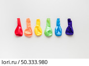 rainbow made deflated air balloons. Стоковое фото, агентство Ingram Publishing / Фотобанк Лори