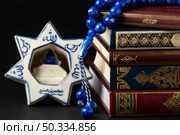 close up islamic new year quran books. Стоковое фото, агентство Ingram Publishing / Фотобанк Лори