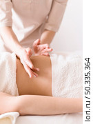 relaxing abdomen massage. Стоковое фото, агентство Ingram Publishing / Фотобанк Лори