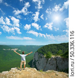 Man in mountain at day strive hands to sun. Element of design. Стоковое фото, агентство Ingram Publishing / Фотобанк Лори