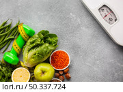 scale with groceries gray background. Стоковое фото, агентство Ingram Publishing / Фотобанк Лори