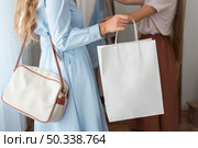 women checking new clothes home. Стоковое фото, агентство Ingram Publishing / Фотобанк Лори