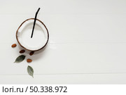 halved coconut with copy space. Стоковое фото, агентство Ingram Publishing / Фотобанк Лори