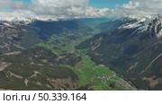 Village in valley and mountain in Alps (2024 год). Стоковое видео, видеограф Михаил Коханчиков / Фотобанк Лори