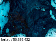 blue liquid with black blobs. Стоковое фото, агентство Ingram Publishing / Фотобанк Лори
