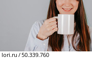 crop woman drinking hot beverage. Стоковое фото, агентство Ingram Publishing / Фотобанк Лори