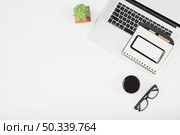 cup coffee with laptop cell phone diary with pen white background. Стоковое фото, агентство Ingram Publishing / Фотобанк Лори