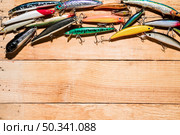 close up many colorful fishing lure wooden desk. Стоковое фото, агентство Ingram Publishing / Фотобанк Лори