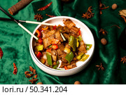 Twice Cooked Pork With Peppers At A Chinese Restaurant On Green Velvet. Стоковое фото, фотограф Aleksandr Golubev / Фотобанк Лори