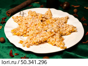 Star Shaped Sachima Dessert Plated on a Table in a Restaurant. Стоковое фото, фотограф Aleksandr Golubev / Фотобанк Лори