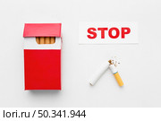 pack cigarettes with message stop smoking. Стоковое фото, агентство Ingram Publishing / Фотобанк Лори