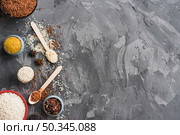 rice turmeric powder star anise peppercorn black weathered backdrop with space text. Стоковое фото, агентство Ingram Publishing / Фотобанк Лори