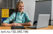 smiley female nurse office with stethoscope laptop. Стоковое фото, агентство Ingram Publishing / Фотобанк Лори