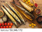 smoked fishes wooden table flat lay. Стоковое фото, агентство Ingram Publishing / Фотобанк Лори
