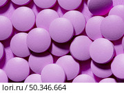 view pills purple background. Стоковое фото, агентство Ingram Publishing / Фотобанк Лори