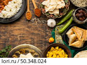 indian food assortment with sari top view. Стоковое фото, агентство Ingram Publishing / Фотобанк Лори