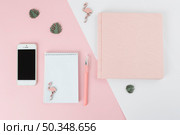 pen near notebook smartphone album little decorations. Стоковое фото, агентство Ingram Publishing / Фотобанк Лори