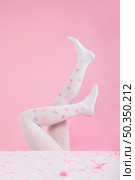 legs tights with paper hearts. Стоковое фото, агентство Ingram Publishing / Фотобанк Лори