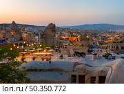 Goreme town on sunset in Cappadocia, Central Anatolia,Turkey. Стоковое фото, агентство Ingram Publishing / Фотобанк Лори