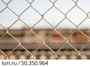 close up chain link fence. Стоковое фото, агентство Ingram Publishing / Фотобанк Лори