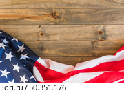 fabric us flag wooden surface. Стоковое фото, агентство Ingram Publishing / Фотобанк Лори