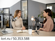 women studio during radio show. Стоковое фото, агентство Ingram Publishing / Фотобанк Лори