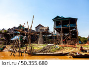 Life on Stilts at Kampong Phluk Floating Village, Tonle Sap (2014 год). Редакционное фото, фотограф Aleksandr Golubev / Фотобанк Лори