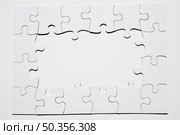 frame made from white puzzle piece white background. Стоковое фото, агентство Ingram Publishing / Фотобанк Лори