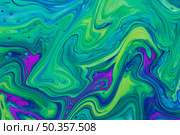 wavy green violet fluid acrylic pour painting. Стоковое фото, агентство Ingram Publishing / Фотобанк Лори