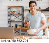 man cooking with dairy products. Стоковое фото, агентство Ingram Publishing / Фотобанк Лори