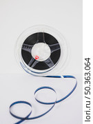 plastic tape with film reel. Стоковое фото, агентство Ingram Publishing / Фотобанк Лори
