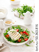 Salad with arugula, mozzarella cheese and pine nuts. Breakfast. Ketogenic, keto or paleo diet. Healthy food. Стоковое фото, агентство Ingram Publishing / Фотобанк Лори