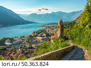Cloudy sky in Kotor Bay with the view of Church Our Lady of Health. Стоковое фото, агентство Ingram Publishing / Фотобанк Лори