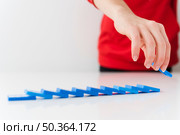 close up fallen domino pieces. Стоковое фото, агентство Ingram Publishing / Фотобанк Лори