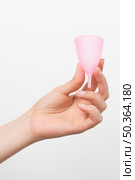 close up hand holding menstrual cup. Стоковое фото, агентство Ingram Publishing / Фотобанк Лори