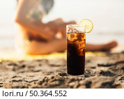 glass coke with ice beach. Стоковое фото, агентство Ingram Publishing / Фотобанк Лори
